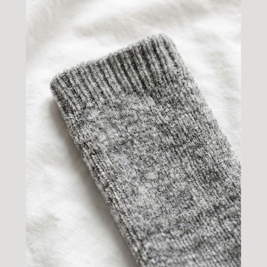 Close-up of the plush chenille knit and ribbed cuff on the grey marl cosy sock