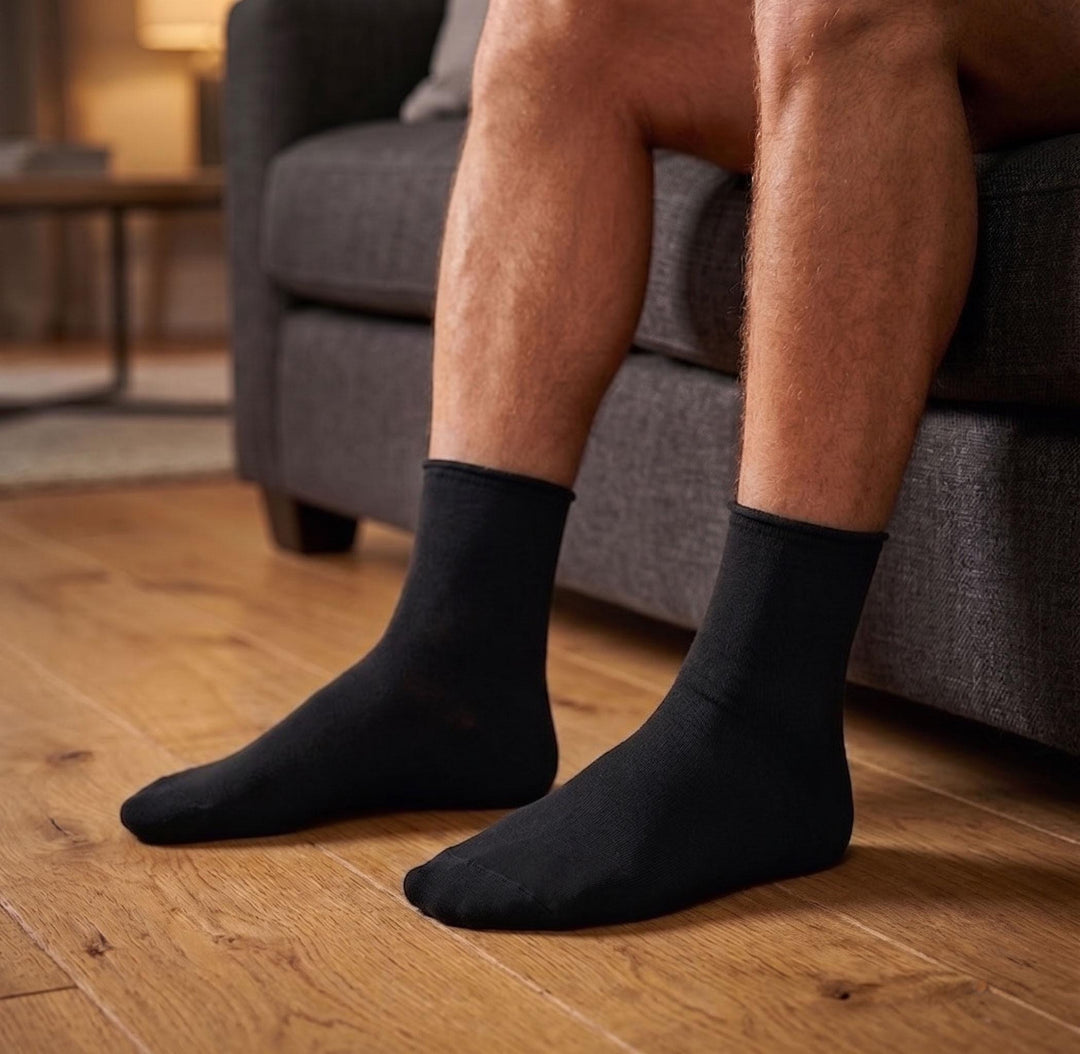 Louluu men's black bamboo no-mark ankle socks worn on feet — non-elastic wide top that leaves no marks