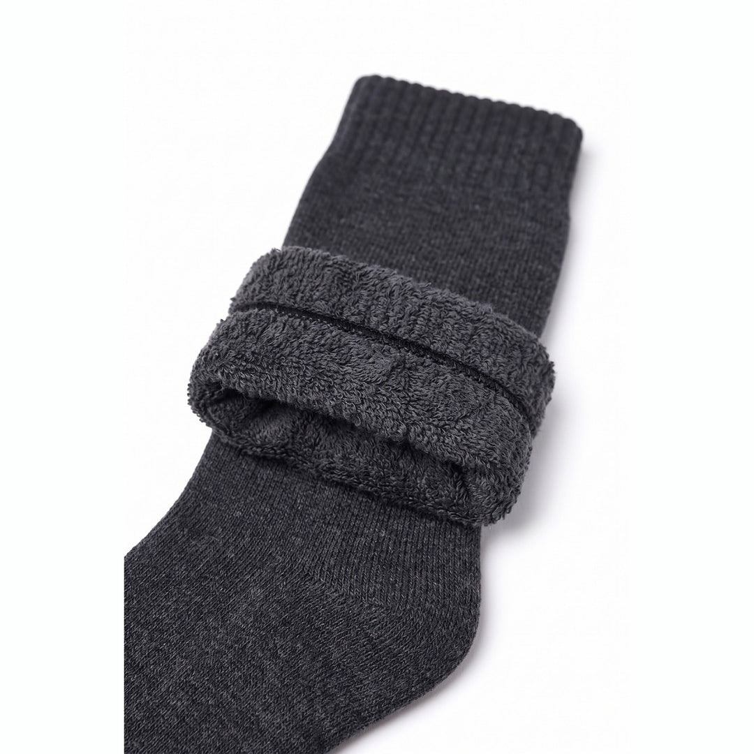 Charcoal fleece lined thermal sock with cuff turned down showing the thick fleece lining